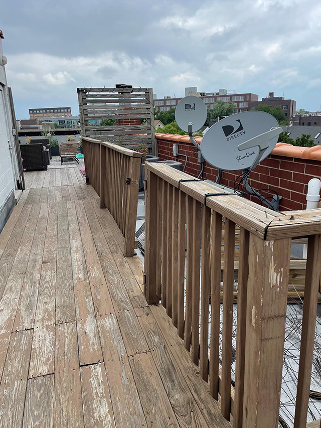 A Wooden Deck With A Satellite Dish On It