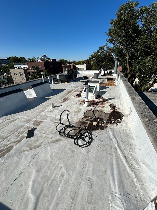 A Roof Covered With A Tarp 