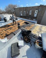 Men Fixing Roof